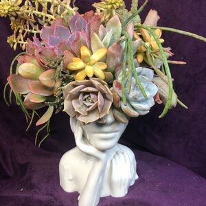 Elegant White Ceramic Face Planter with Colorful Succulents